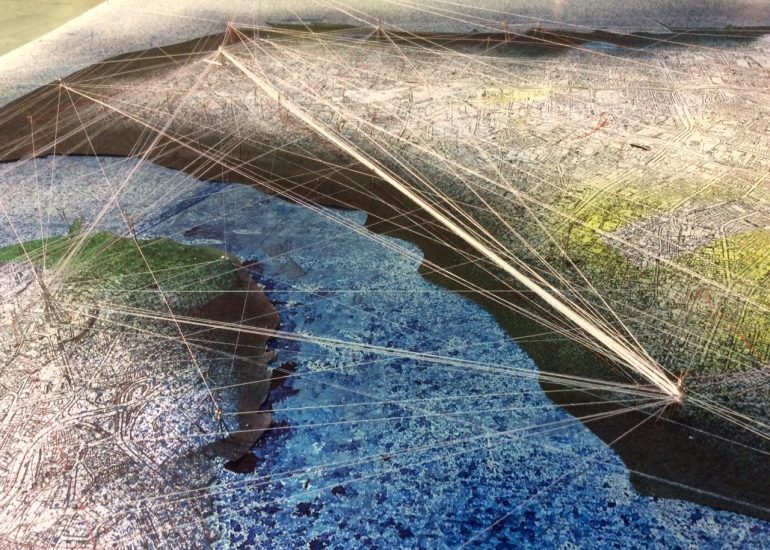 Threshold physical mapping model with contoured terrain, colored regions, and radiating thread connections.