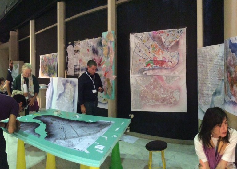 Threshold physical mapping model with contoured terrain, colored regions, and radiating thread connections.
